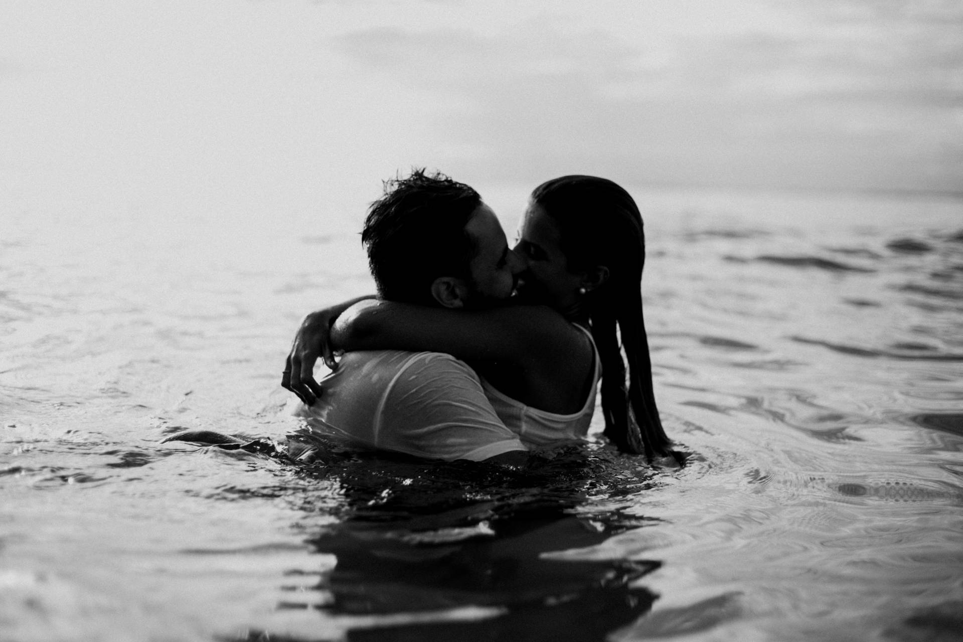 two people playing in the water